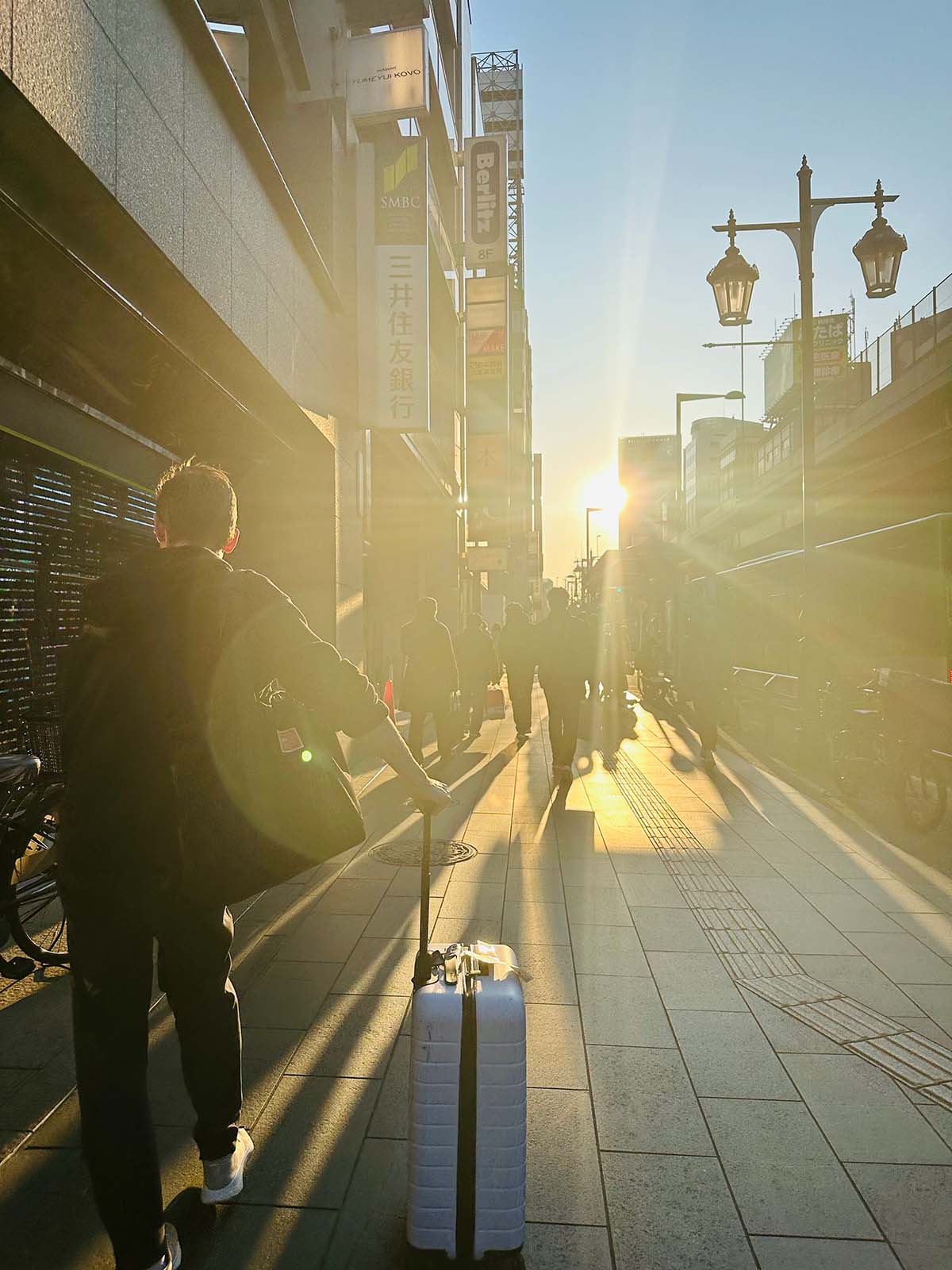 A backlit, sunflare-y capture of Tokyo's streets at sunset.