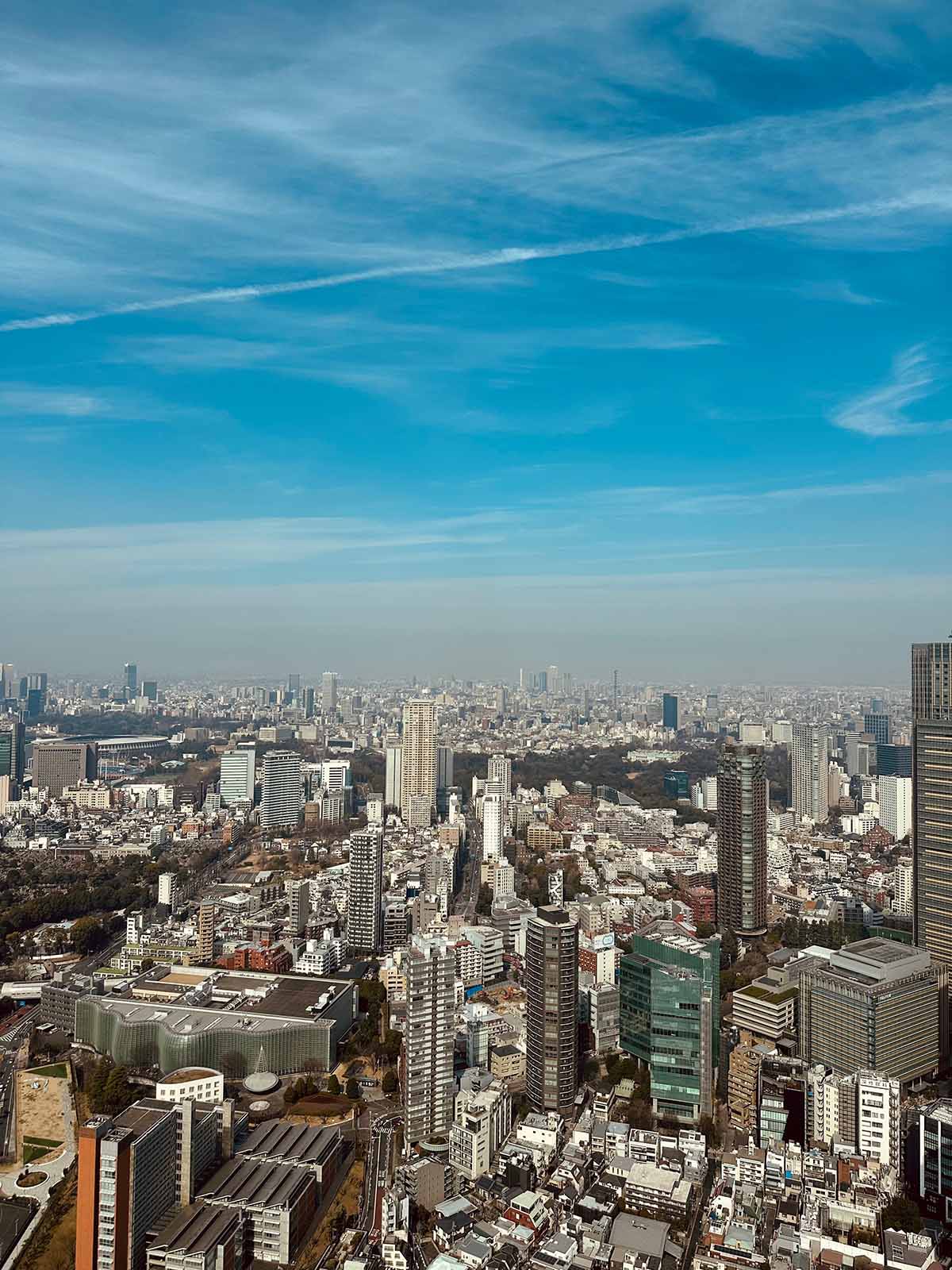 A city view of Tokyo's skyscrapers on a sunny day.